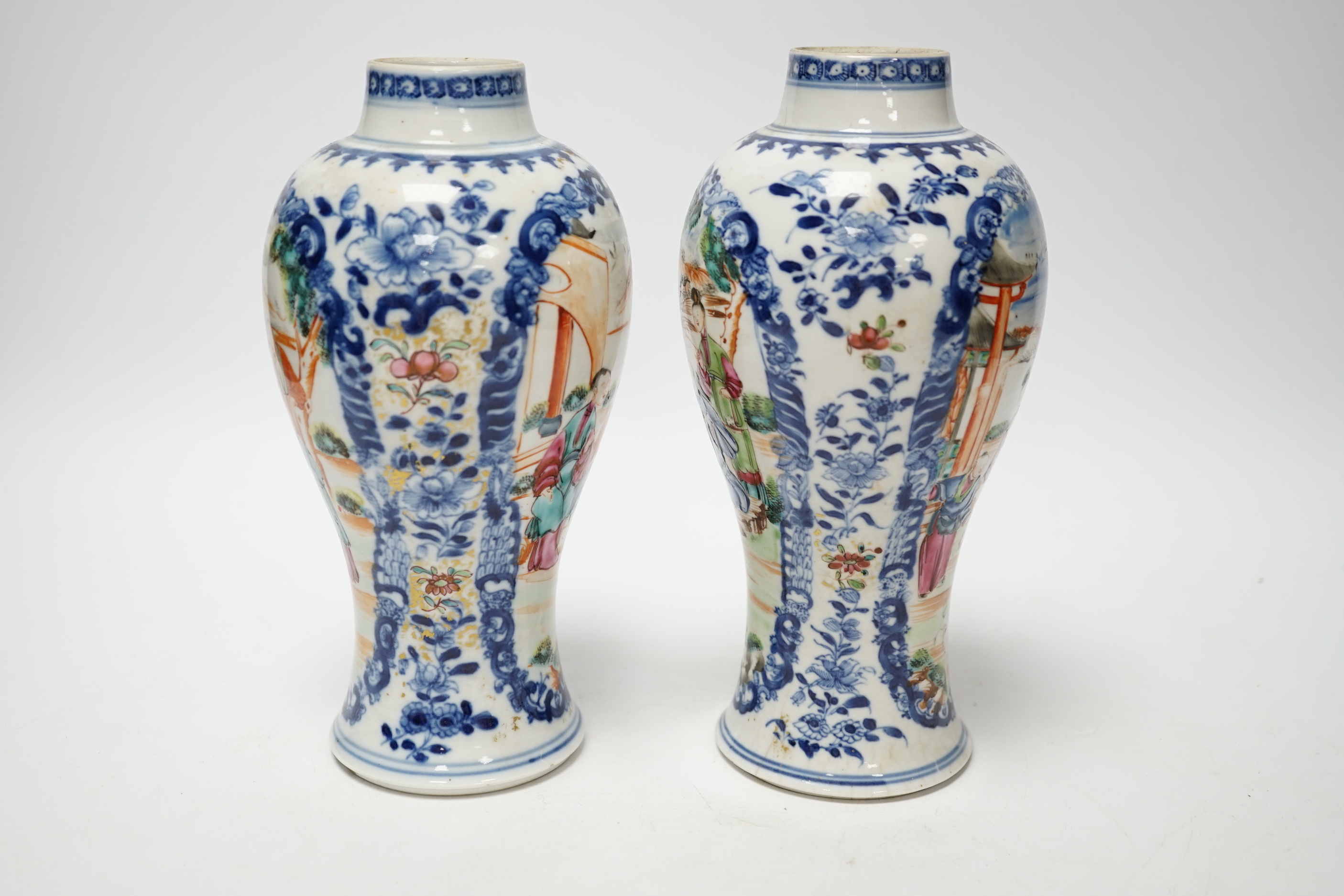 A pair of late 18th century Chinese famille rose ‘mandarin’ vases, 19cm high